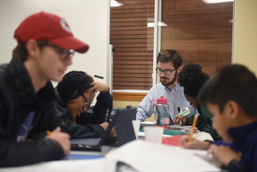 Truman Runyan works with students at Grade A Plus